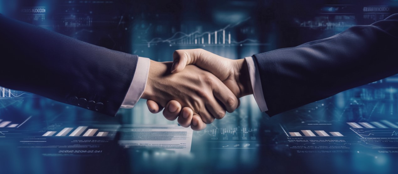 Two business people shaking hands after closing a license agreement