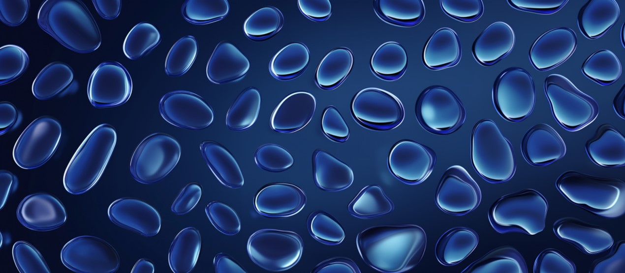 Image of shimmering drops floating across a blue background.