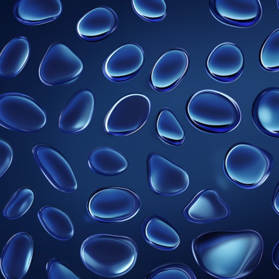 Image of shimmering drops floating across a blue background.