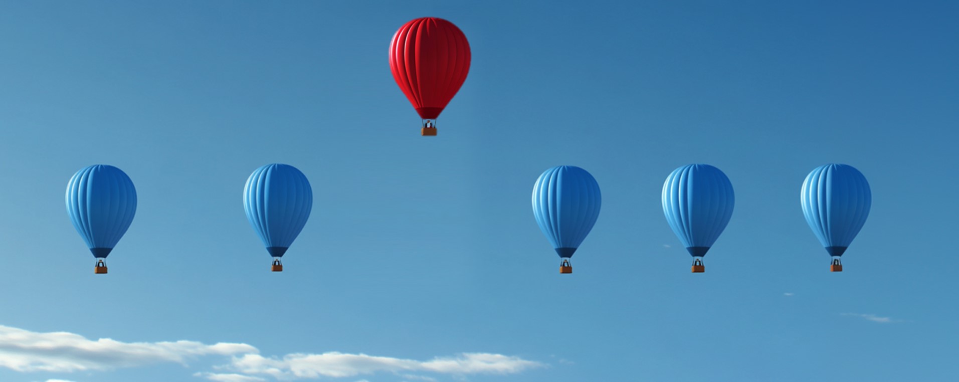 Photo with a front view of blue hot air balloons flying at the same altitude. Only one balloon is red and has risen significantly higher as a symbol for strategy.